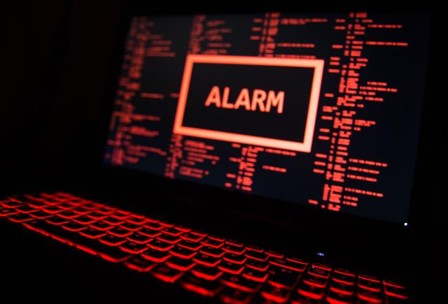 FILED - 19 November 2016, Stuttgart: A computer screen is showing a red alarm. Photo: Lino Mirgeler/dpa