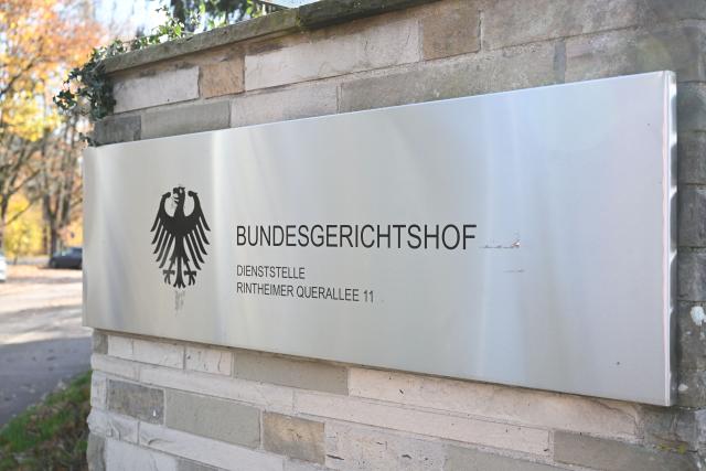 FILED - 11 November 2025, Baden-Württemberg, Karlsruhe: A sign with the federal eagle and the inscription "Bundesgerichtshof Dienststelle Rintheimer Querallee 11", taken in front of the entrance to the area. An Afghan man is to be remanded in custody after he was arrested in Denmark earlier this year on suspicion of plotting attacks on Jews in Germany, the German Federal Court of Justice ruled on Monday. Photo: Uli Deck/dpa