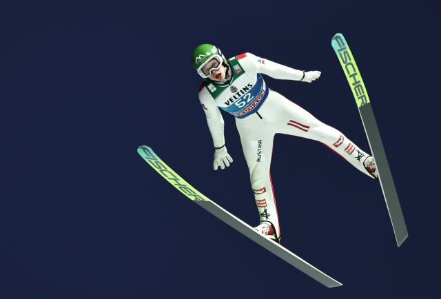 31 December 2025, Bavaria, Garmisch-Partenkirchen: Austria's Jonas Schuster competes in the men's large hill qualification at the Four Hills Tournament World Cup ski jumping event. Photo: Daniel Karmann/dpa