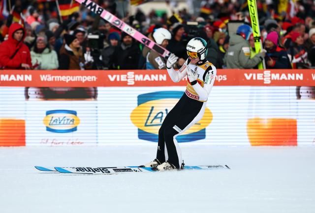 01 January 2026, Bavaria, Garmisch-Partenkirchen: Winner Slovenia's Domen Prevc celebrates at the finish line after the Men's large hill 2nd round of the Four Hills Tournament in the World Cup. Photo: Daniel Karmann/dpa