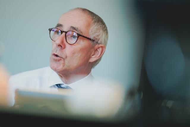 FILED - 12 December 2025, Berlin: Peter Adrian, President of the German Chamber of Industry and Commerce (DIHK), speaks in an interview with the German Press Agency. Photo: Carsten Koall/dpa