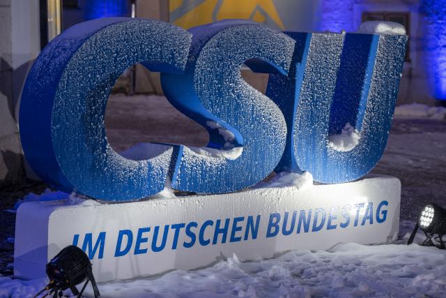 FILED - 07 January 2024, Bavaria, Seeon: Snow lies on a large logo of the Christian Social Union (CSU) during the party's winter conference. Photo: Peter Kneffel/dpa