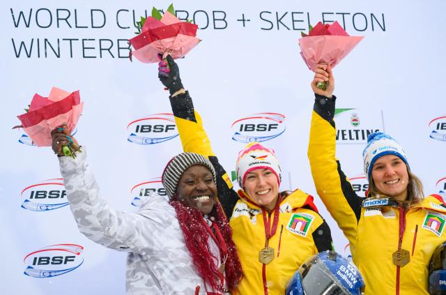 03 January 2026, North Rhine-Westphalia, Winterberg: (L-R) Canada's second-placed Cynthia Appiah, Germany's winner Laura Nolte and Germany's third-placed Lisa Buckwitz celebrate on the podium after the 2nd run of the Women's monobob competition during the IBSF Bobsleigh World Cup in Winterberg. Photo: Robert Michael/dpa