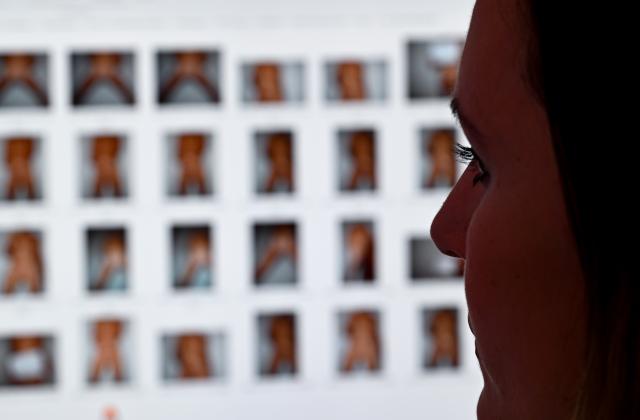 FILED - 23 August 2023, Hesse, Frankfurt/M.: Prosecutor Julia Bussweiler, Child Pornography and Child Sexual Abuse Unit, sits in front of a monitor with photos in her office at the Central Office for Combating Internet and Computer Crime (ZIT). Photo: Arne Dedert/dpa