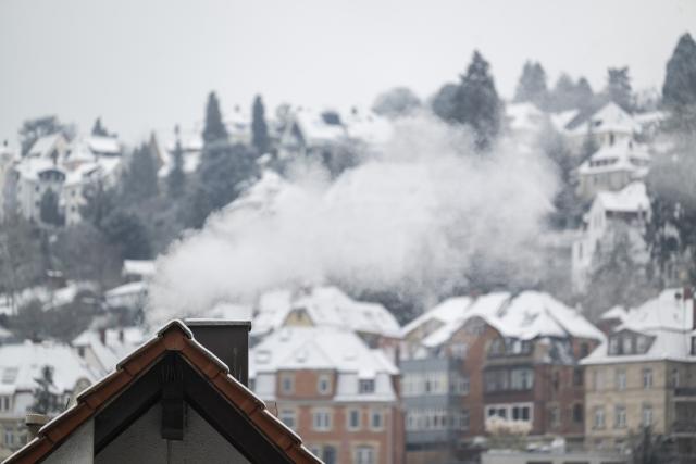 06 January 2026, Baden-Württemberg, Stuttgart: Exhaust air comes out of a chimney in Stuttgart. Photo: Marijan Murat/dpa