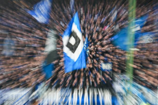 FILED - 07 December 2025, Hamburg: Hamburg SV flag is pictured in the stands before the German Bundesliga soccer match between Hamburg SV and SV Werder Bremen at the Volksparkstadion. Photo: Marcus Brandt/dpa