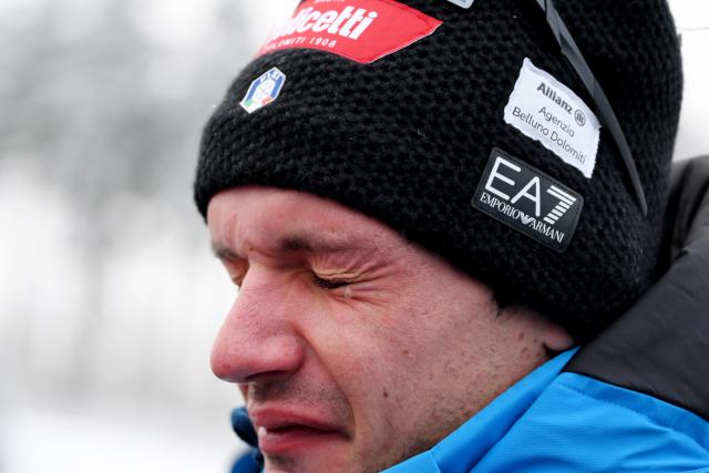 07 January 2026, Thuringia, Oberhof: Italian biathlete Tommaso Giacomel fights back tears while speaking to media after the death of Norwegian biathlete Sivert Guttorm Bakken, before the IBU Biathlon World Cup in Oberhof. Photo: Hendrik Schmidt/dpa
