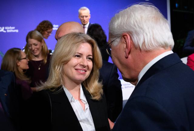 07 January 2026, Berlin: German President Frank-Walter Steinmeier (L) welcomes former Slovak President Zuzana Caputova to the Koerber Foundation symposium entitled "Democracy as a Mission" on the occasion of Federal President Steinmeier's 70th birthday at the Academy of Arts. Photo: Bernd von Jutrczenka/dpa