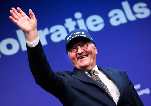 07 January 2026, Berlin: German President Frank-Walter Steinmeier wears a cap with the inscription "Democracy as a Mission," which he had previously received as a gift at the Koerber Foundation symposium entitled "Democracy as a Mission" on the occasion of his 70th birthday at the Academy of Arts on Pariser Platz. Photo: Bernd von Jutrczenka/dpa