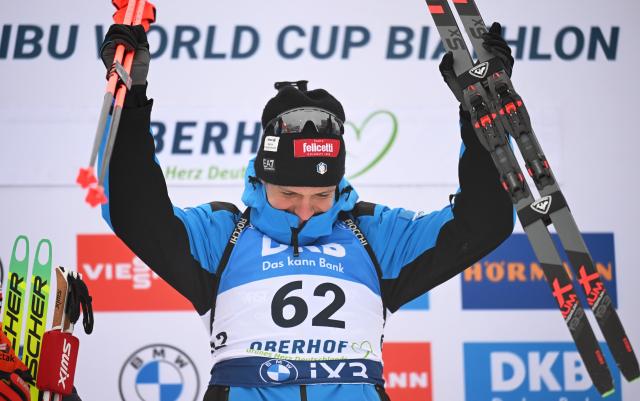 08 January 2026, Thuringia, Oberhof: Italy's winner Tommaso Giacomel celebrates his victory on the podium after the Men's Sprint 10 km competition of the IBU Biathlon World Cup in Oberhof. Photo: Hendrik Schmidt/dpa