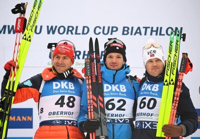 08 January 2026, Thuringia, Oberhof: Germany's second-placed Philipp Nawrath, Italy's winner Tommaso Giacomel (C) and Norway's third-placed Johannes Dale-Skjevdal celebrate after the Men's Sprint 10 km competition of the IBU Biathlon World Cup in Oberhof. Photo: Hendrik Schmidt/dpa