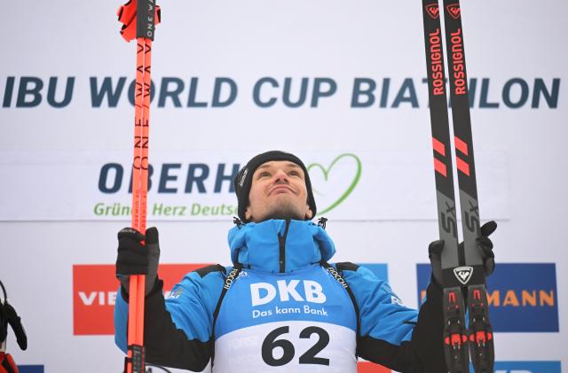 08 January 2026, Thuringia, Oberhof: Italy's winner Tommaso Giacomel celebrates his victory on the podium after the Men's Sprint 10 km competition of the IBU Biathlon World Cup in Oberhof. Photo: Hendrik Schmidt/dpa