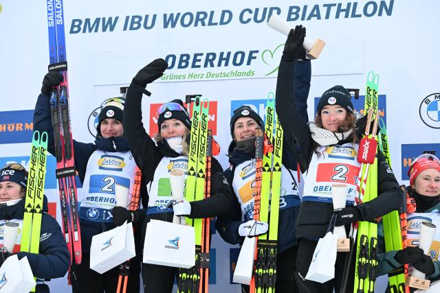 10 January 2026, Thuringia, Oberhof: (L-R) France's Julia Simon, Oceane Michelon, Justine Braisaz-Bouchet and Julia Simon celebrate on the podium after the women's 4 x 6 km relay event of the IBU Biathlon World Cup in Oberhof. Photo: Hendrik Schmidt/dpa