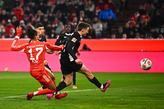 11 January 2026, Bavaria, Munich: Wolfsburg's Kilian Fischer scores an own goal during the German Bundesliga soccer match between Bayern Munich and VfL Wolfsburg at Allianz Arena. Photo: Tom Weller/dpa - IMPORTANT NOTICE: DFL and DFB regulations prohibit any use of photographs as image sequences and/or quasi-video.