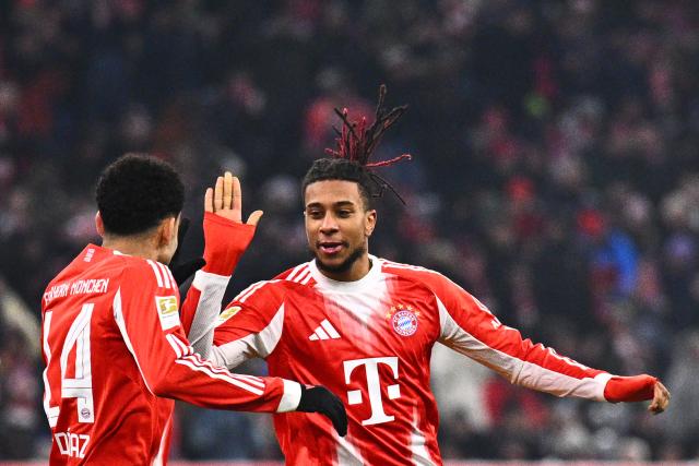 11 January 2026, Bavaria, Munich: Bayern Munich's Michael Olise celebrates scoring his side's third goal with his teammate Luis Diaz during the German Bundesliga soccer match between Bayern Munich and VfL Wolfsburg at Allianz Arena. Photo: Tom Weller/dpa - IMPORTANT NOTICE: DFL and DFB regulations prohibit any use of photographs as image sequences and/or quasi-video.
