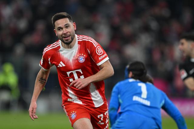 11 January 2026, Bavaria, Munich: Bayern Munich's Raphael Guerreiro celebrates scoring his side's fifth goal during the German Bundesliga soccer match between Bayern Munich and VfL Wolfsburg at Allianz Arena. Photo: Sven Hoppe/dpa - IMPORTANT NOTICE: DFL and DFB regulations prohibit any use of photographs as image sequences and/or quasi-video.