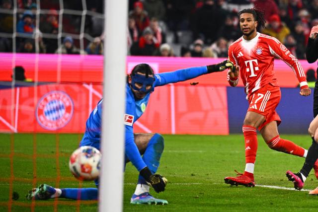 11 January 2026, Bavaria, Munich: Bayern Munich's Michael Olise scores his side's seventh goal during the German Bundesliga soccer match between Bayern Munich and VfL Wolfsburg at Allianz Arena. Photo: Tom Weller/dpa - IMPORTANT NOTICE: DFL and DFB regulations prohibit any use of photographs as image sequences and/or quasi-video.