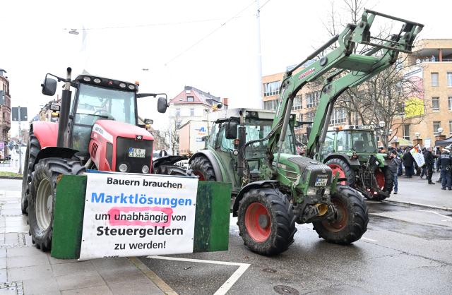 12 January 2026, Baden-Württemberg, Stuttgart: Dairy farmers demonstrate with tractors in front of the Ministry of Agriculture in Stuttgart, under the slogan "Crisis management now - relieve the milk market now". Photo: Bernd Weißbrod/dpa