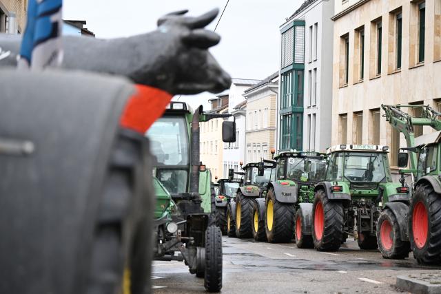 12 January 2026, Baden-Württemberg, Stuttgart: Dairy farmers demonstrate with tractors in front of the Ministry of Agriculture in Stuttgart, under the slogan "Crisis management now - relieve the milk market now". Photo: Bernd Weißbrod/dpa