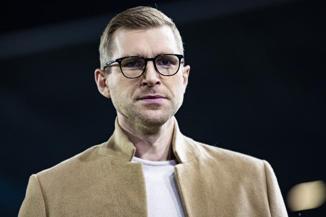 FILED - 19 October 2022, Bayern, Augsburg: Germany 2014 World Cup winner Per Mertesacker speaks to TV before the German DFB Cup soccer match between Augsburg and Bayern Munich at the WWK-Arena.  Mertesacker will leave his role as Arsenal's head of youth development at the end of the season after eight years, the Premier League leaders said on Monday. Photo: Tom Weller/dpa