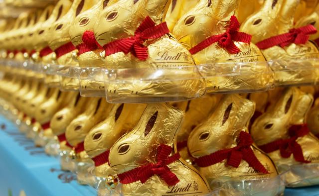 FILED - 09 March 2016, Bavaria, Munich: Lindt gold bunnies can be seen in a store. The Swiss chocolate and confectionery manufacturer Lindt & Sprüngli said on Tuesday that its sales last year rose by 8.2% to 5.92 billion Swiss francs ($7.42 billion), mainly influenced by a negative currency effect of 3.9%. Photo: Amelie Sachs/dpa