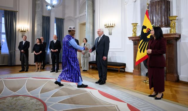 13 January 2026, Berlin: German President Frank-Walter Steinmeier welcomes Aliou Barry, Ambassador of Guinea to Germany, together with Reem Alabali Radovan (R), German Minister for Economic Cooperation and Development, at the Federal President's New Year's Reception for the Diplomatic Corps at Bellevue Palace. Photo: Bernd von Jutrczenka/dpa