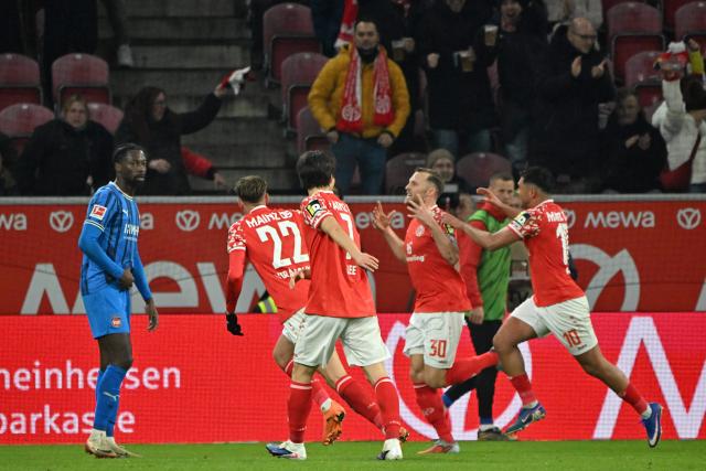 13 January 2026, Rhineland-Palatinate, Mainz: Mainz' Silvan Dominic Widmer celebrates scoring his side's first goal during the German Bundesliga soccer match between FSV Mainz 05 and  1. FC Heidenheim at Mewa Arena. Photo: Torsten Silz/dpa - IMPORTANT NOTICE: DFL and DFB regulations prohibit any use of photographs as image sequences and/or quasi-video.