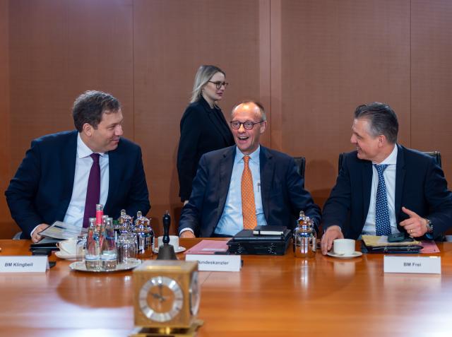 14 January 2026, Berlin: (L-R) Lars Klingbeil, Germany's Finance Minister, Chancellor Friedrich Merz, and Head of the Federal Chancellery and Federal Minister for Special Tasks Thorsten Frei, speak at the start of the cabinet meeting. Photo: Soeren Stache/dpa