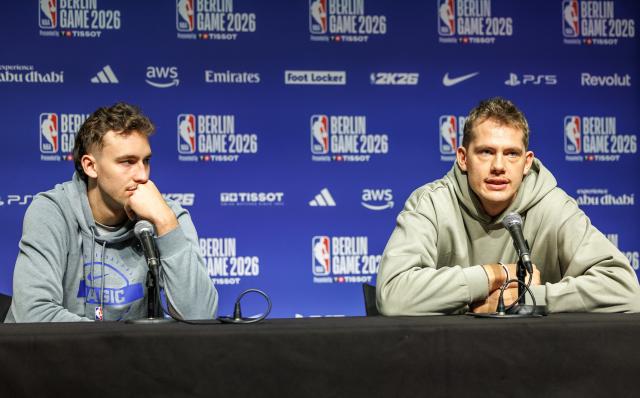 13 January 2026, Berlin: Orlando Magic's Franz Wagner (L) and Moritz Wagner attend a press conference ahead of the NBA regular season match against the Memphis Grizzlies.. Photo: Andreas Gora/dpa