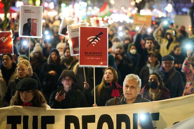 14 January 2026, Berlin: People hold banners and placards during a demonstration under the slogan "Protest against the death machine of the Islamic Republic of Iran," organized by the Woman Life Freedom Collective. Photo: Annette Riedl/dpa