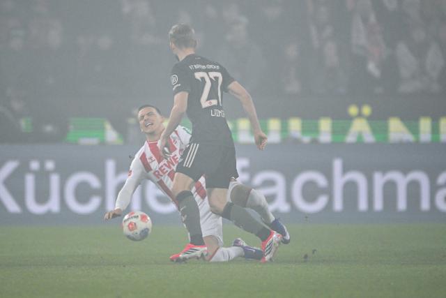 14 January 2026, North Rhine-Westphalia, Cologne: Cologne's Said El Mala (L) and Bayern Munich's Konrad Laimer battle for the ball during the German Bundesliga soccer match between 1. FC Cologne and Bayern Munich at RheinEnergieStadion. Photo: Federico Gambarini/dpa - IMPORTANT NOTICE: DFL and DFB regulations prohibit any use of photographs as image sequences and/or quasi-video.