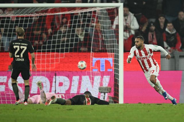14 January 2026, North Rhine-Westphalia, Cologne: Cologne's Linton Maina (R) celebrates scoring his side's first goal during the German Bundesliga soccer match between 1. FC Cologne and Bayern Munich at RheinEnergieStadion. Photo: Federico Gambarini/dpa - IMPORTANT NOTICE: DFL and DFB regulations prohibit any use of photographs as image sequences and/or quasi-video.