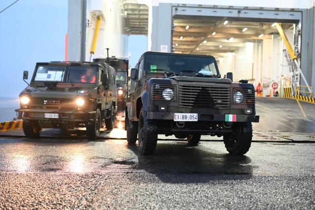 15 January 2026, Lower Saxony, Emden: Italian soldiers arrive with equipment and vehicles as The North Atlantic Treaty Organization (NATO) launches "Steadfast Dart," its largest multinational exercise of the year. Photo: Lars Penning/dpa