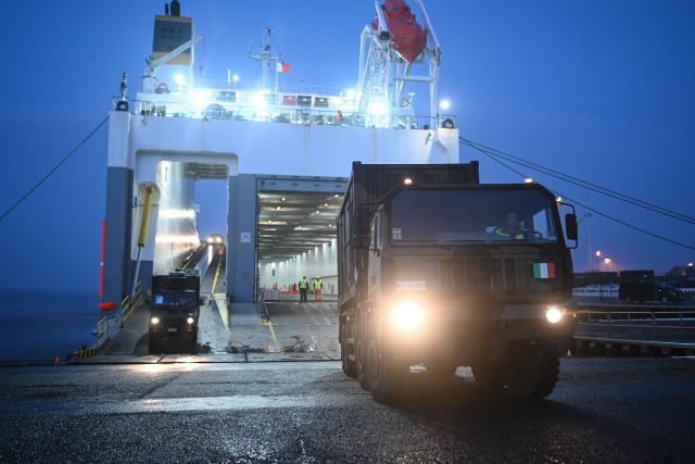 15 January 2026, Lower Saxony, Emden: Italian soldiers arrive with equipment and vehicles as The North Atlantic Treaty Organization (NATO) launches "Steadfast Dart," its largest multinational exercise of the year. Photo: Lars Penning/dpa