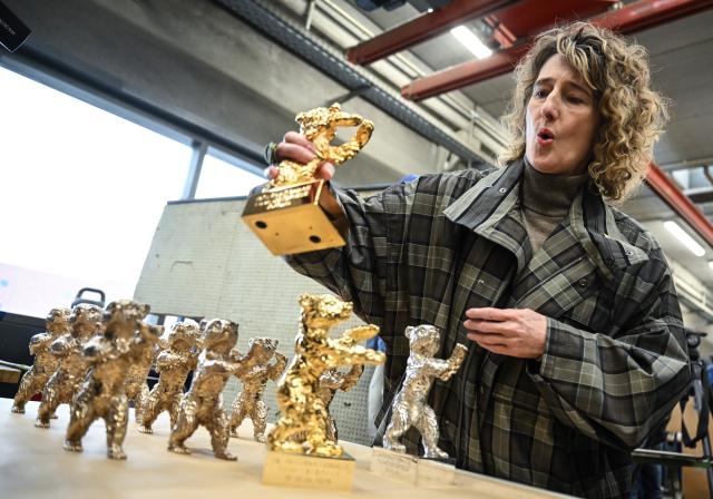 15 January 2026, Berlin: Berlinale Director Tricia Tuttl examines the trophies during a press event for the production of the Berlinale Bears at the Hermann Noack Foundry. The 2026 Berlin International Film Festival (Berlinale), will take place from February 12 to 22. Photo: Britta Pedersen/dpa