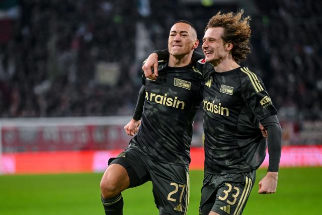 15 January 2026, Bavaria, Augsburg: Union Berlin's Marin Ljubicic celebrates scoring his side's first goal with his teammate Alex Kral during the German Bundesliga soccer match between FC Augsburg and 1. FC Union Berlin at WWK-Arena. Photo: Harry Langer/dpa - IMPORTANT NOTE: In accordance with the regulations of the DFL German Football League and the DFB German Football Association, it is prohibited to utilize or have utilized photographs taken in the stadium and/or of the match in the form of sequential images and/or video-like photo series.