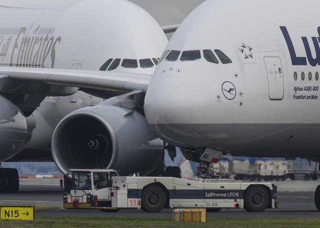 FILED - 30 January 2020, Hesse, Frankfurt/Main: Two Airbus A-380s belonging to Emirates and Lufthansa meet on the tarmac at Frankfurt Airport. Passenger numbers at Germany's largest airport in Frankfurt remain well below the levels seen before the coronavirus pandemic, operator Fraport said on Friday. Photo: Boris Roessler/dpa