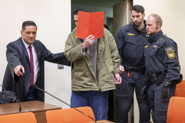 16 January 2026, Bavaria, Munich: The defendant Farhad N. arrives in the courtroom at the start of his trial on charges of double murder following a car attack on a demonstration in Munich on February 13, 2025. Photo: Peter Kneffel/dpa
