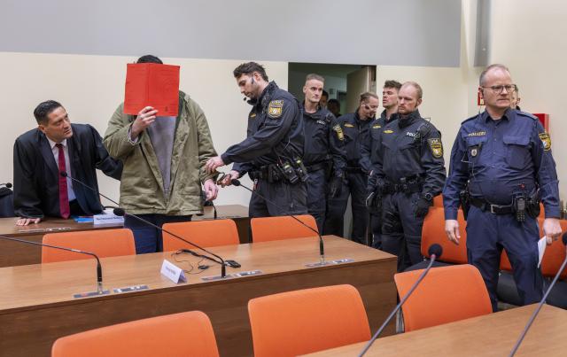 16 January 2026, Bavaria, Munich: The defendant Farhad N. arrives in the courtroom at the start of his trial on charges of double murder following a car attack on a demonstration in Munich on February 13, 2025. Photo: Peter Kneffel/dpa