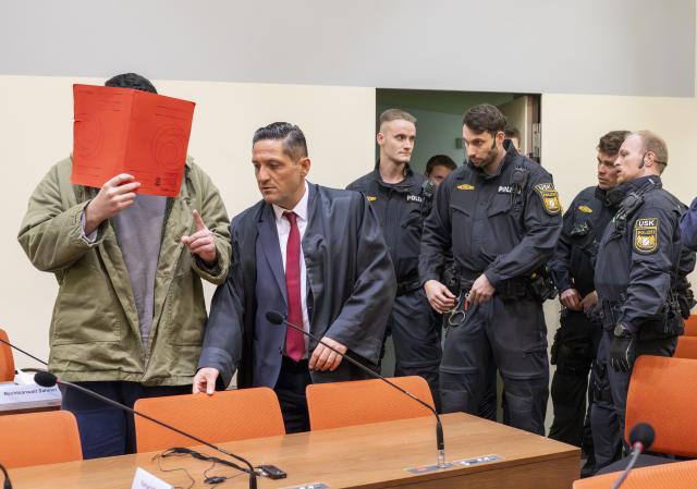 16 January 2026, Bavaria, Munich: The defendant Farhad N. arrives in the courtroom at the start of his trial on charges of double murder following a car attack on a demonstration in Munich on February 13, 2025. Photo: Peter Kneffel/dpa