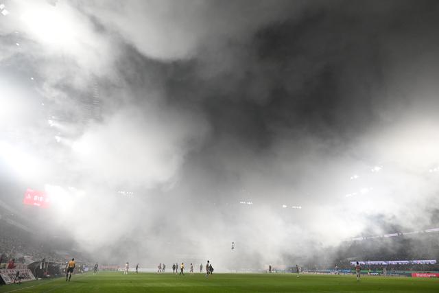 FILED - 14 January 2026, North Rhine-Westphalia, Cologne: A general view of the smoke from pyrotechnics during the German Bundesliga soccer match between 1. FC Cologne and Bayern Munich at RheinEnergieStadion. Photo: Federico Gambarini/dpa - IMPORTANT NOTICE: DFL and DFB regulations prohibit any use of photographs as image sequences and/or quasi-video.