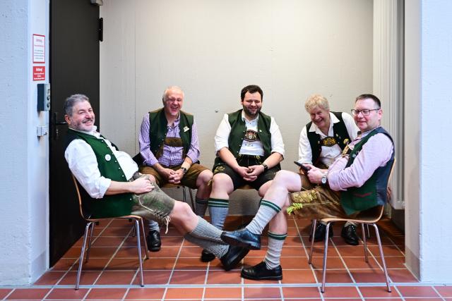 16 January 2026, Berlin: Staff at the Bavaria stand take a break during the first day of the 90th International Green Week. Photo: Sebastian Christoph Gollnow/dpa