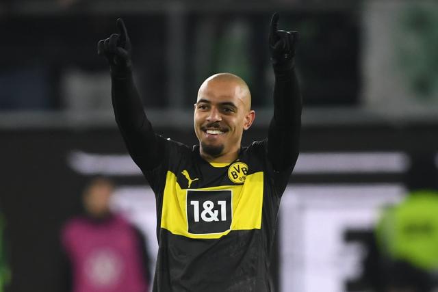 FILED - 22 December 2024, Lower Saxony, Wolfsburg: Dortmund's Donyell Malen celebrates after his goal during the German Bundesliga soccer match between VfL Wolfsburg and Borussia Dortmundat Volkswagen Arena. Photo: Swen Pförtner/dpa
