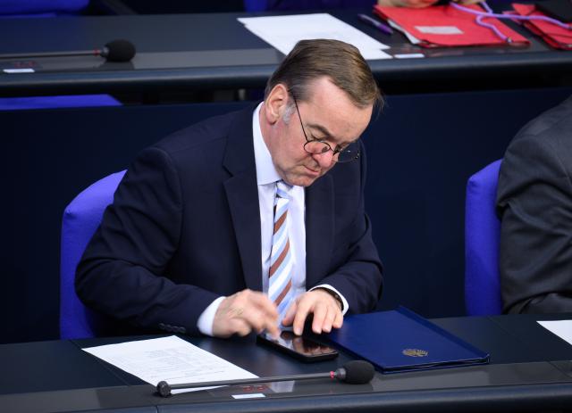 16 January 2026, Berlin: Boris Pistorius, German Defence Minister, types on his smartphone during the 54th plenary session of the 21st legislative period in the German Bundestag. Photo: Bernd von Jutrczenka/dpa