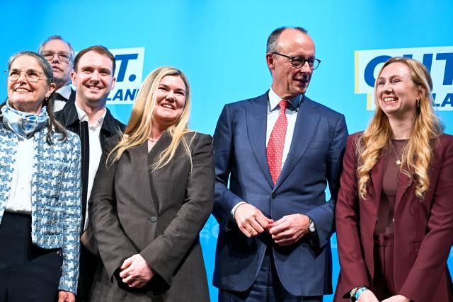 16 January 2026, Baden-Württemberg, Heddesheim: German Chancellor Friedrich Merz (2nd L) stands on stage with party members during an election campaign event of the Christian Democratic Union at the Pfenning Logistics forwarding company in Heddesheim. Photo: Uwe Anspach/dpa