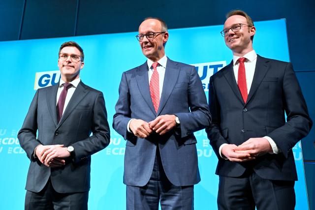 16 January 2026, Baden-Württemberg, Heddesheim: (L-R) Manuel Hagel, Christian Democratic Union (CDU) Baden-Wuerttemberg's top candidate, German Chancellor Friedrich Merz and Bastian Schneider, CDU candidate in the Rhine-Neckar region are pictured on stage during a CDU election campaign event at the Pfenning Logistics forwarding company in Heddesheim. Photo: Uwe Anspach/dpa