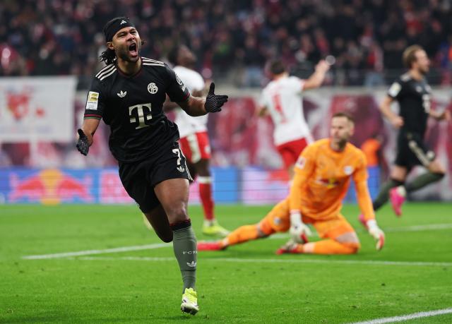 17 January 2026, Saxony, Leipzig: Bayern Munich's Serge Gnabry celebrates scoring his side's first goal during the German Bundesliga soccer match between RB Leipzig and Bayern Munich at rhe Red bull Arena. Photo: Jan Woitas/dpa
