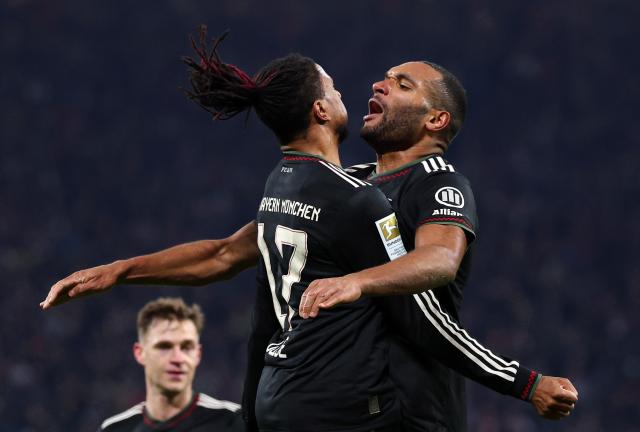 17 January 2026, Saxony, Leipzig: Bayern Munich's Jonathan Tah celebrates scoring his side's third goal with teammate Michael Olise during the German Bundesliga soccer match between RB Leipzig and Bayern Munich at rhe Red bull Arena. Photo: Jan Woitas/dpa