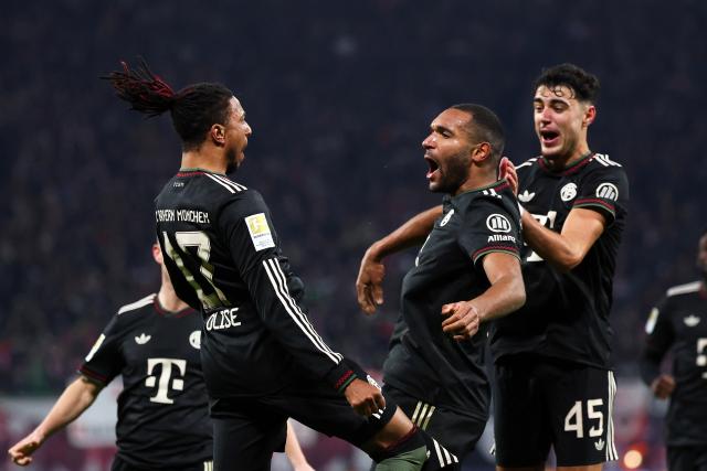 17 January 2026, Saxony, Leipzig: Bayern Munich's Jonathan Tah celebrates scoring his side's third goal with teammates Michael Olise and Aleksandar Pavlovic during the German Bundesliga soccer match between RB Leipzig and Bayern Munich at rhe Red bull Arena. Photo: Jan Woitas/dpa