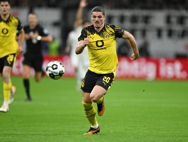 FILED - 28 October 2025, Hesse, Frankfurt/Main: Dortmund's Marcel Sabitzer runs during the German cup soccer match between  Eintracht Frankfurt and Borussia Dortmund at Deutsche Bank Park. Photo: Arne Dedert/dpa - IMPORTANT NOTE: In accordance with the regulations of the DFL German Football League and the DFB German Football Association, it is prohibited to utilize or have utilized photographs taken in the stadium and/or of the match in the form of sequential images and/or video-like photo series.